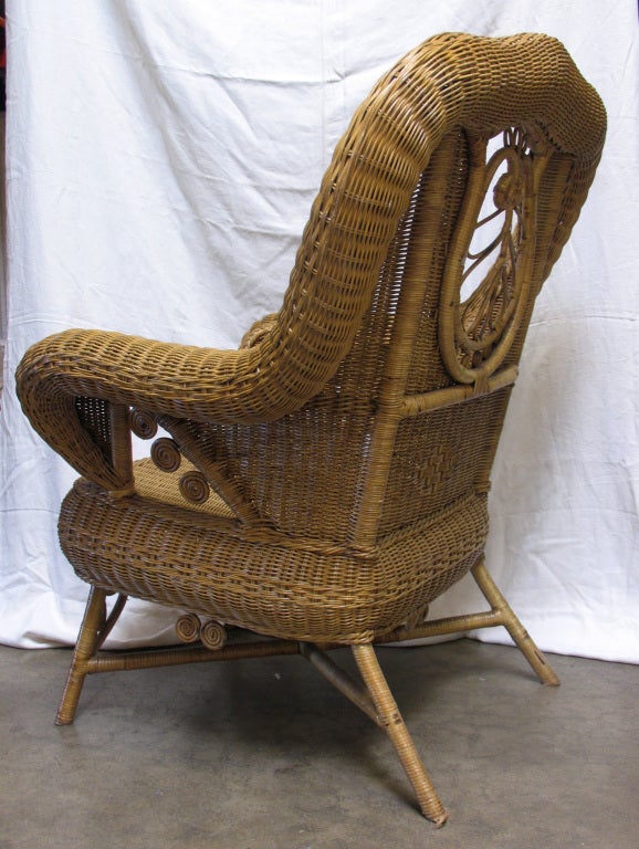 c.1880's Beautiful large scale woven wicker Wing Back armchair with scallop back and braided detail in natural wicker finish. (28