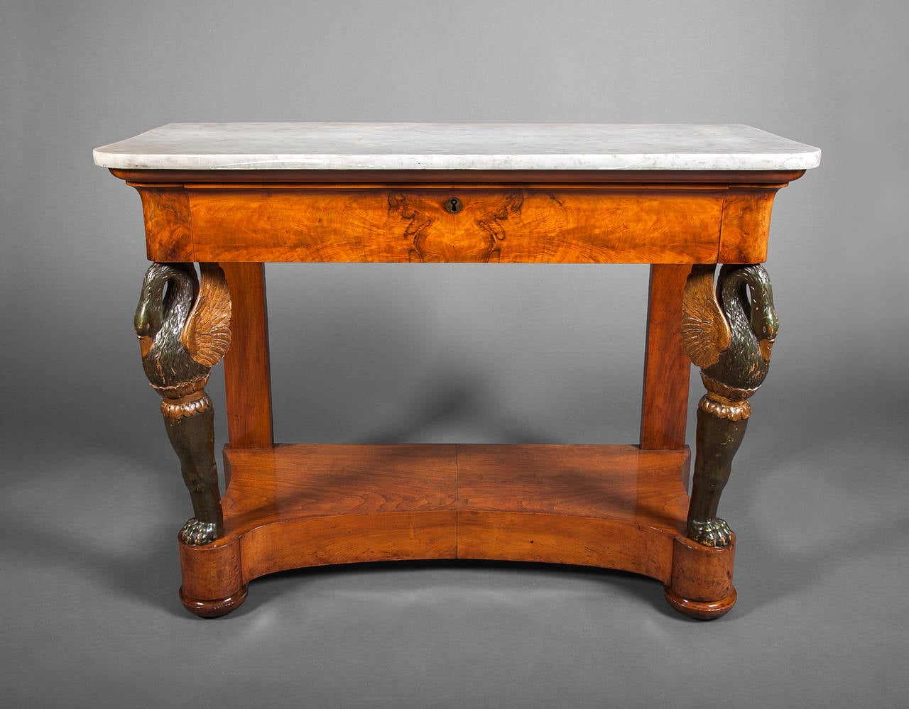 Biedermeier Continental console table with carved swan legs and a single drawer.