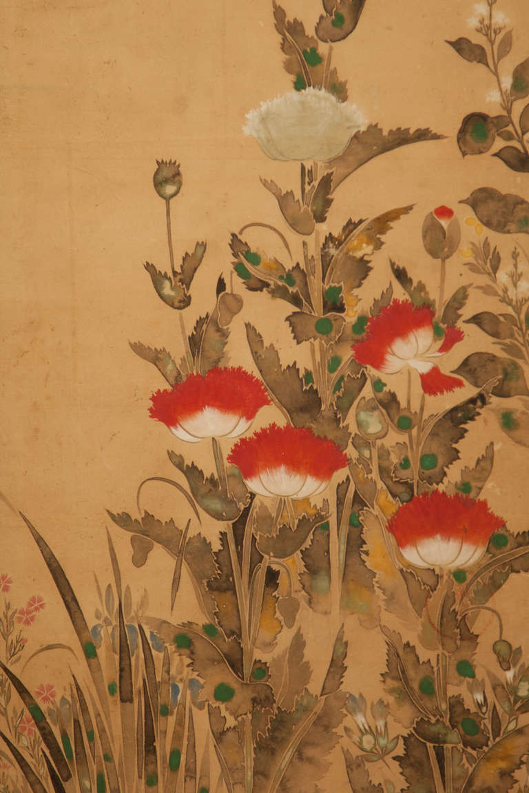 Late Rimpa School painting of a variety of flowering plants:  peony, magnolia, poppy, chrysanthemum, mukuge and hyacinth. Three panels bear a circular red seal (unclear). Ink and pigments on paper applied to gold foil paper.