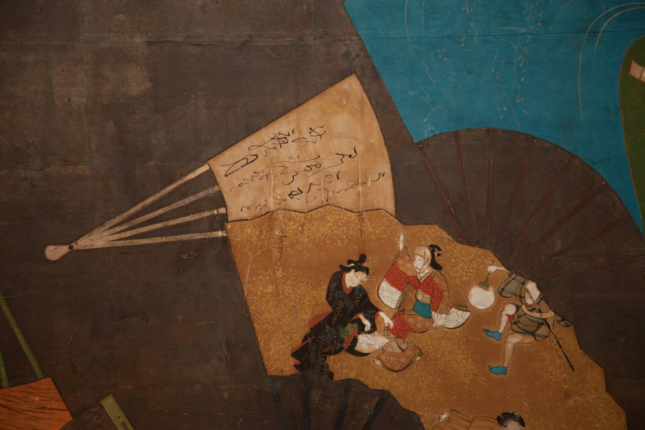 Japanese Screen: Painted fans. Open fans depicting wild pinks, Heian period folks, otogi inu (dog shaped boxes, Okuni dancers with poems and closed fans, on silver leaf. Tosa school.