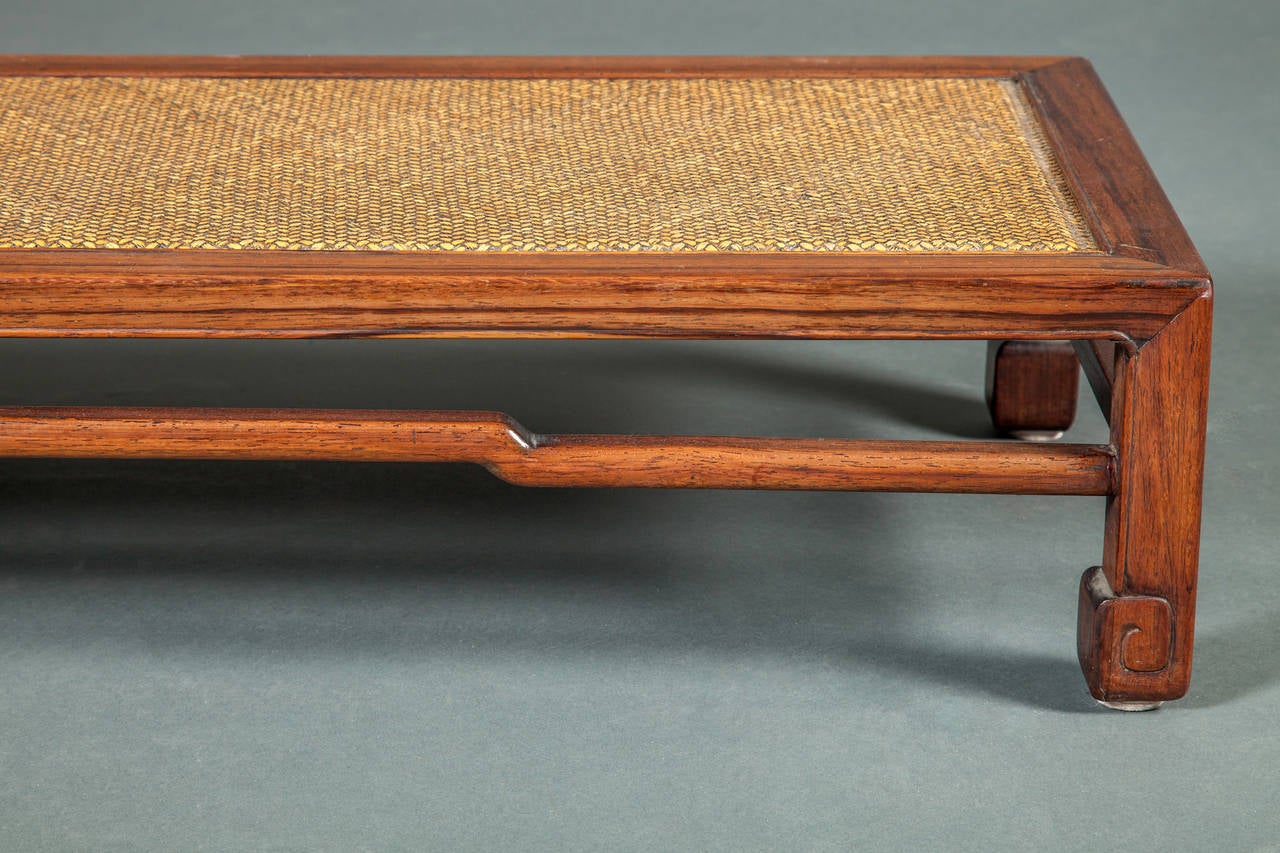 Chinese rosewood Kang table with rattan top.