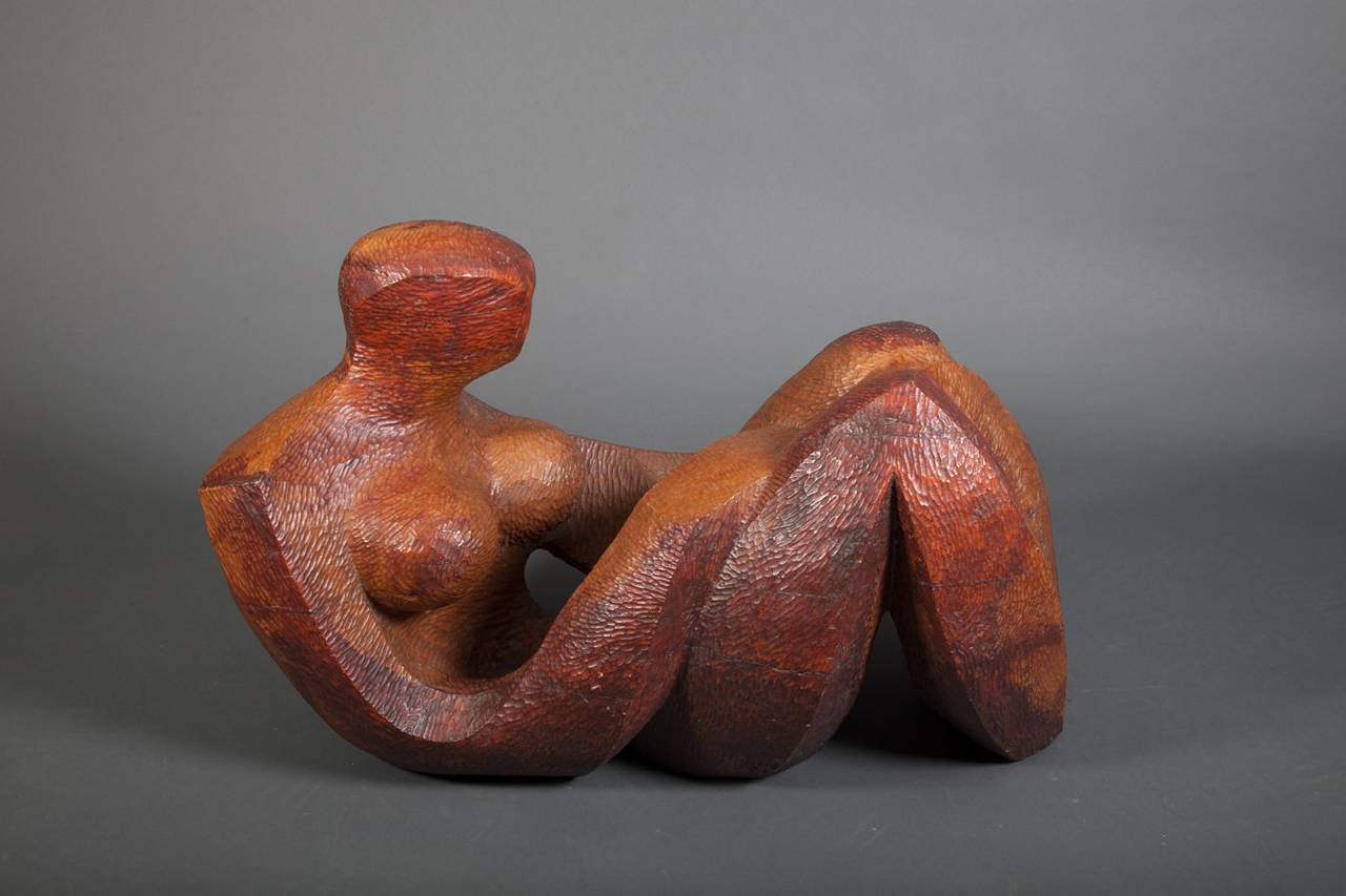 Abstract sculpture of a reclining woman by Robert Hughes (1915-2004). This abstract sculpture is of a reclining woman with her head and knees up. Born in Providence, Rhode Island and later residing in Berlin, New Hampshire, Hughes became well-known