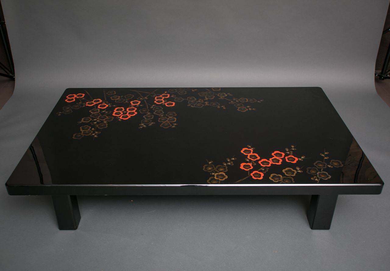 Japanese Wakasa lacquer table with coral quince design.
Signature not readable.