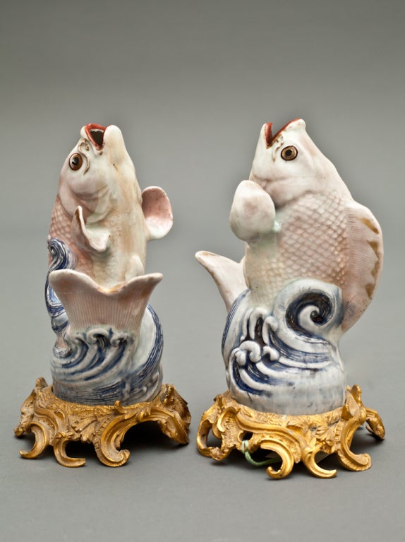 Pair of Japanese Arita ware leaping fish,
18th century, with 19th century ormolu mounts. Measures: 8 1/2