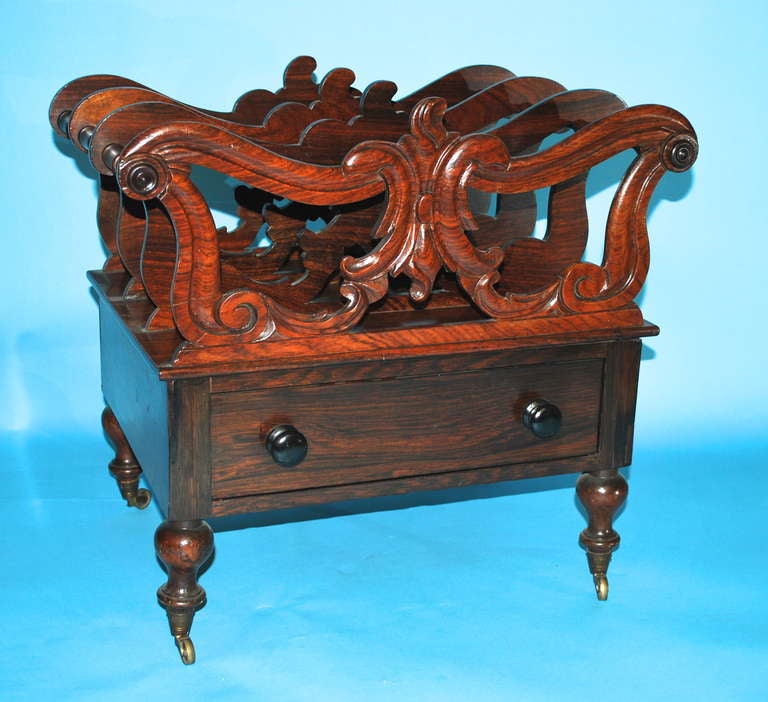 An English late Regency period rosewood canterbury with a single drawer, circa 1835.