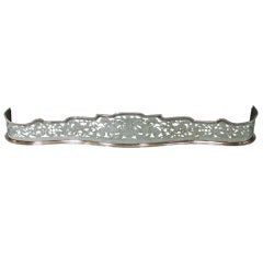 Georgian Polished Steel Pierced and Engraved Fire Fender with Dogs