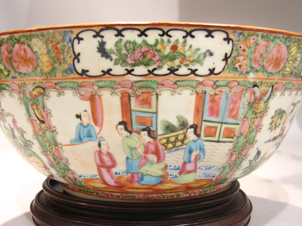 A large Chinese export Rose Medallion punch bowl decorated overall with flowers and figures.