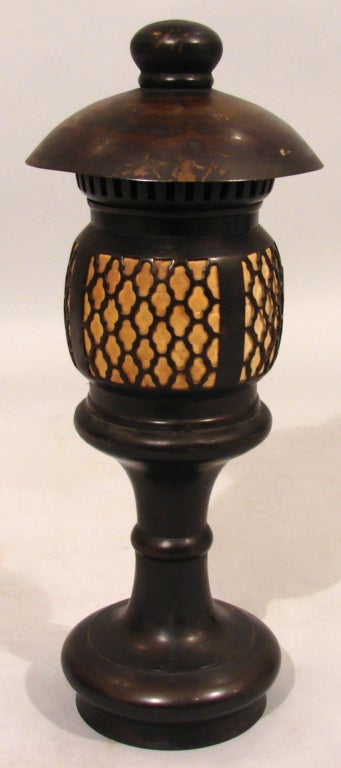 A Japanese bronze candle lantern of pagoda form, late Meiji period, circa 1900.