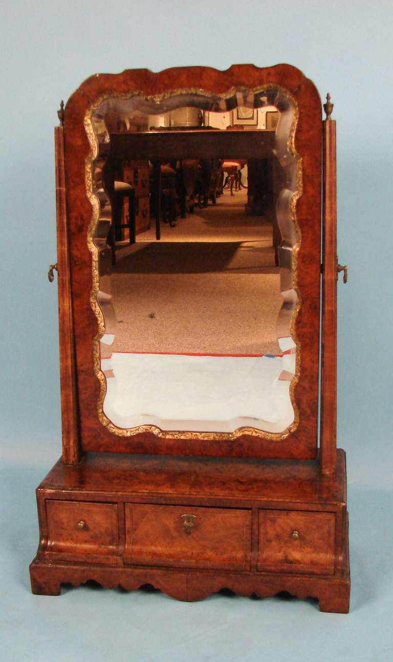 A George I inlaid burl walnut and parcel gilt dressing mirror first quarter 18th century.