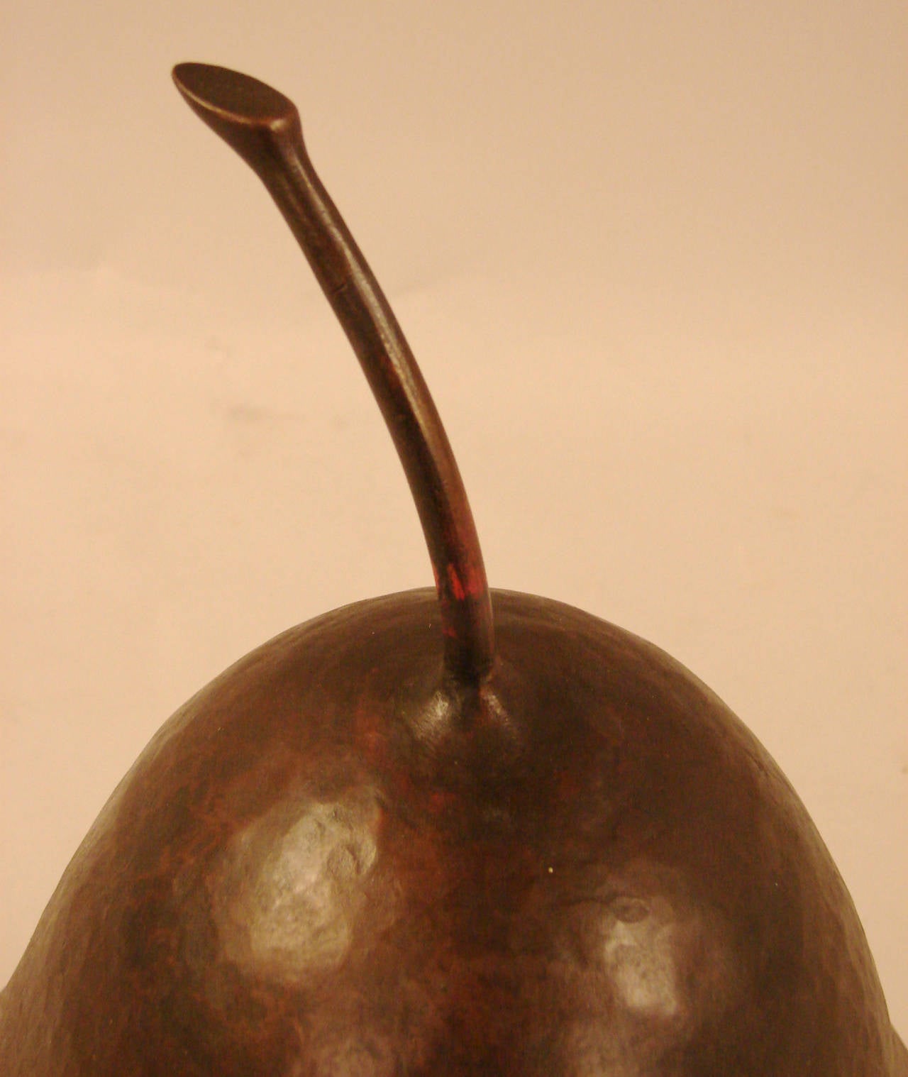 A large copper hammered pear by sculpture Robert Kuo, circa 1990.