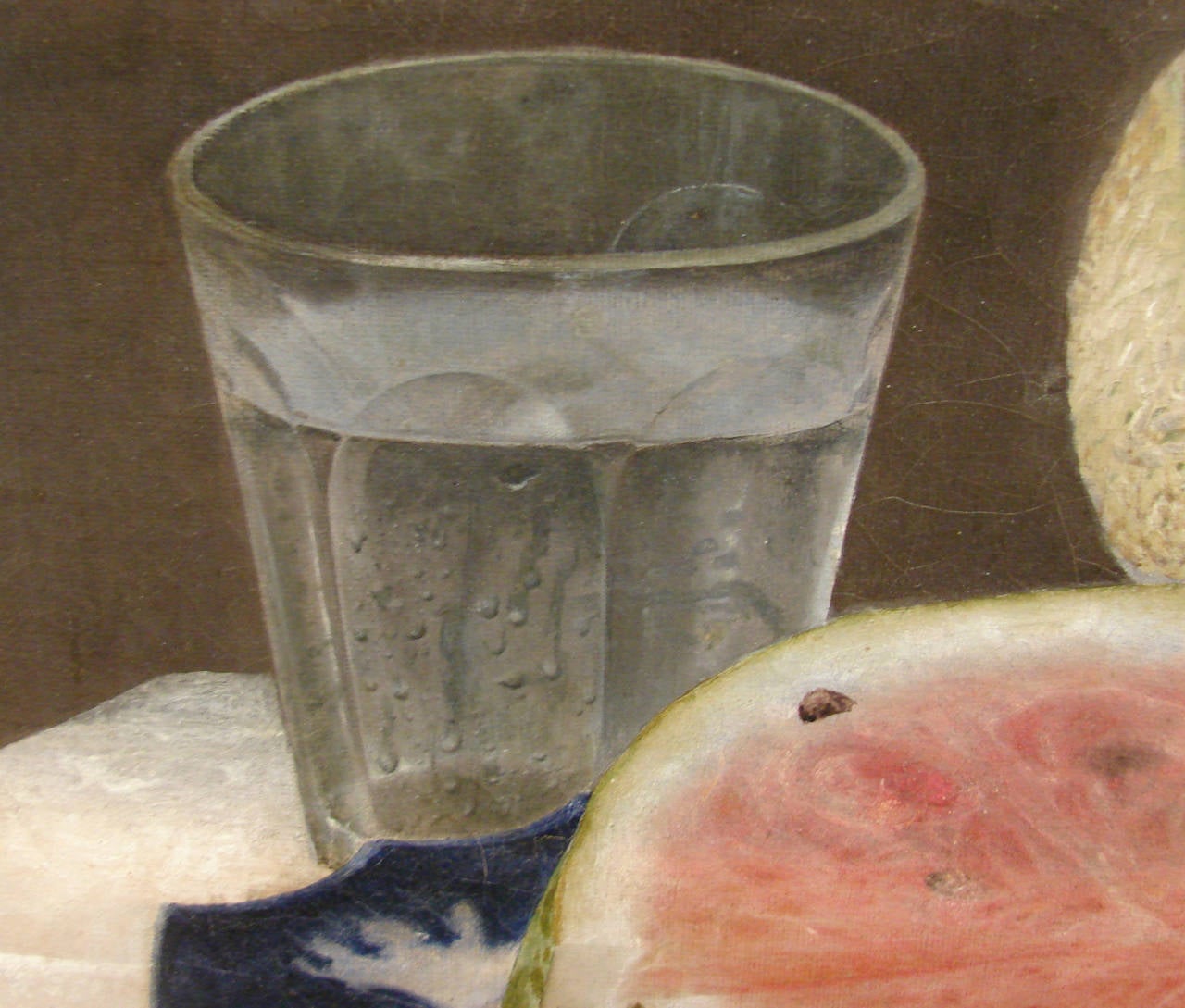 An American still life oil on canvas depicting luscious melons and summer fruit on a set table. Appears to retain its original giltwood frame, circa 1860.
