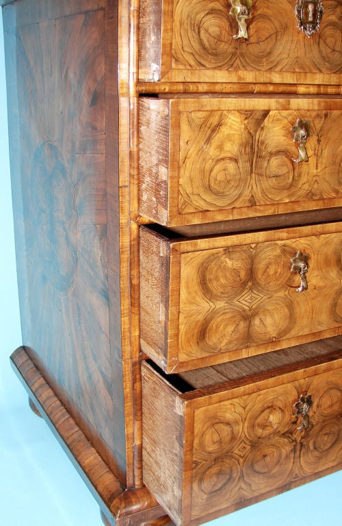 Walnut A fine William and Mary walnut oyster veneer chest of drawers