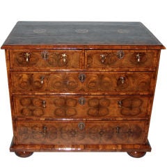 A fine William and Mary walnut oyster veneer chest of drawers