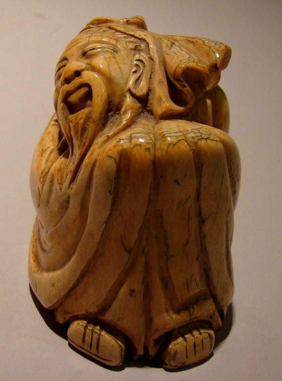 Chinese Patinated ivory carving of an elder