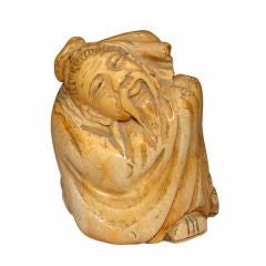 Patinated ivory carving of an elder