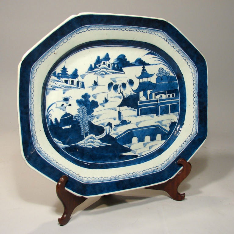 A Chinese dark blue Canton octagonal platter of typical form decorated overall with houses and a bridge, circa 1850.