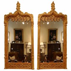 Matched pair of English Gothic design giltwood mirrors