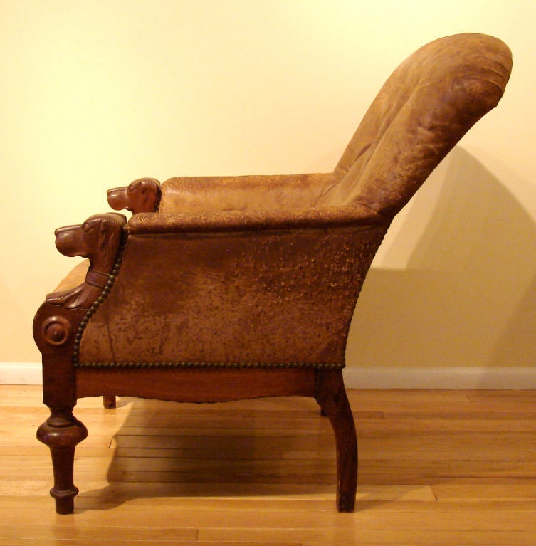 antique chair with carved dog heads