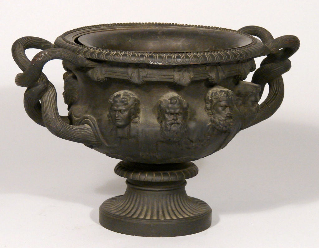 A late 19th century Continental well cast bronze model of the Warwick vase with liner.