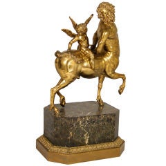 Brass minotaur with putto on a marble base