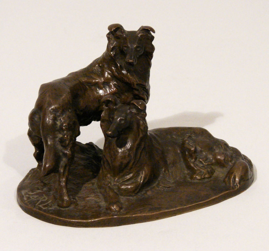 A patinated bronze of 2 collies after a model by Otto Jarl, (Swedish 1856-1915) signed Jarl and stamped with Austrian foundry marks: 