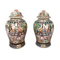 Pair of Polychrome Chinese Lidded Vases Pair of Polychrome Chinese Lidded Vases