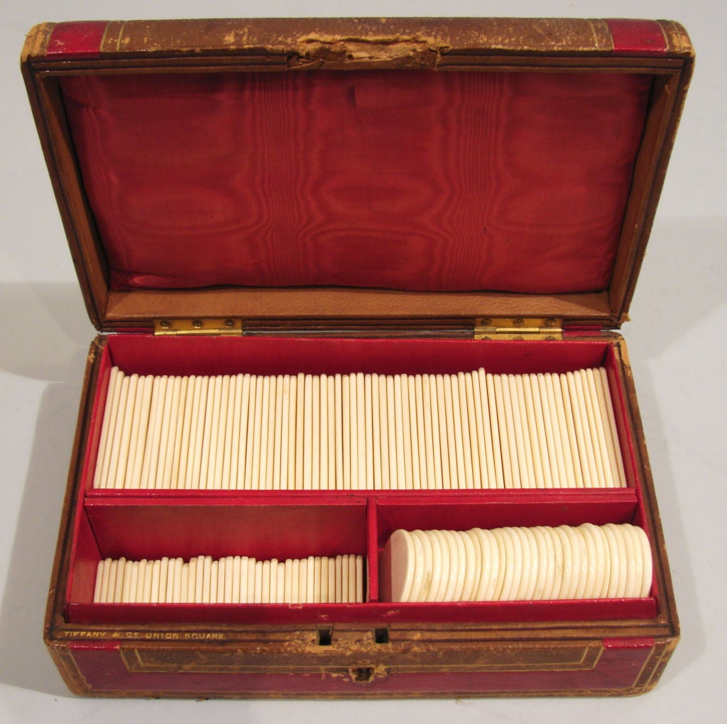 A leather boxed game set, the red morocco box signed 