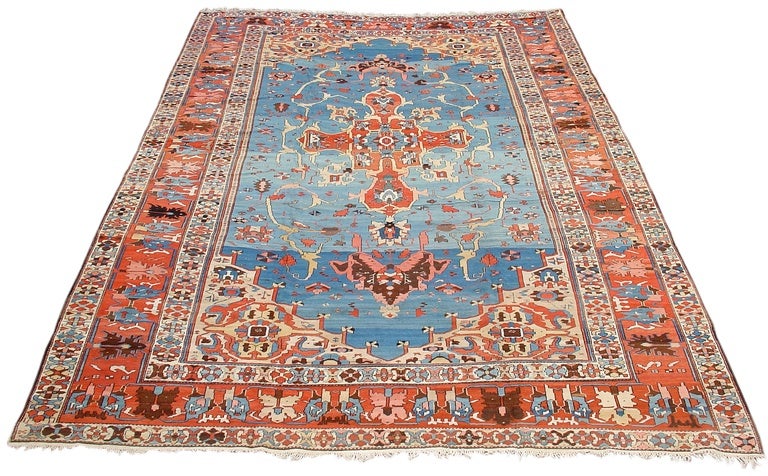 With its elegantly drawn design and soft variegated blue ground evoking translucent rippling water, this carpet represents the “best of the best” on all levels. Colors are expertly matched: Coral and terracotta hues complement the contrasting