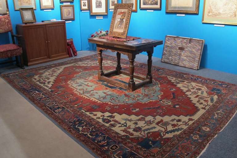 This exceptional Serapi carpet demonstrates the continuity and evolution of design and weaving traditions of Northwest Persia. The scale of ornament in this piece is smaller and more refined than most of its type and for the size of the piece may