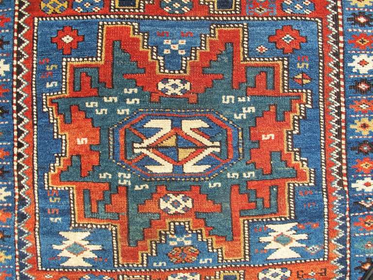 Wool Late 19th Century Varied Red and Blue Lesghi Star Kuba Rug For Sale