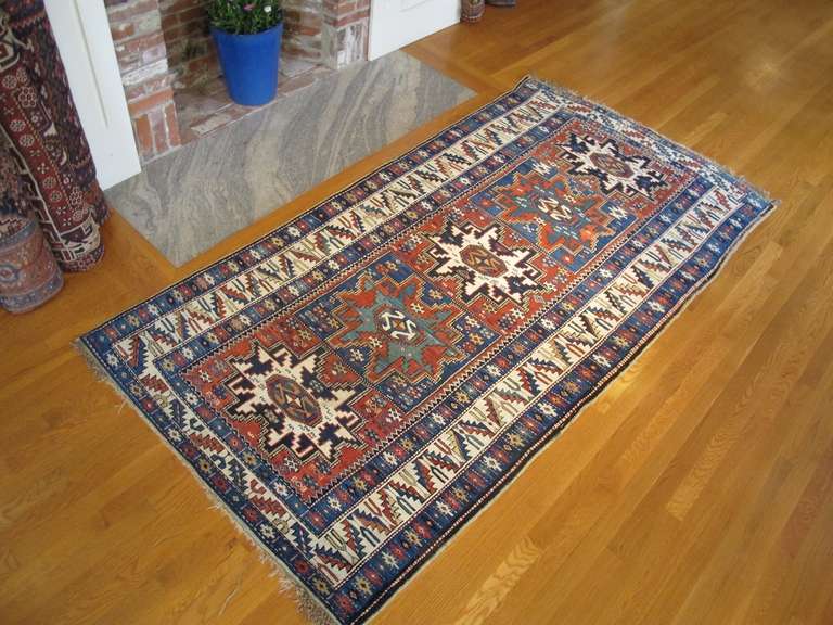 The iconic star design of this South Caucasian long rug is named for the Lezgian people of northern Azerbaijan and southern Daghestan, an area where many of these pieces were woven. This Kuba piece, however, originates from further south and speaks