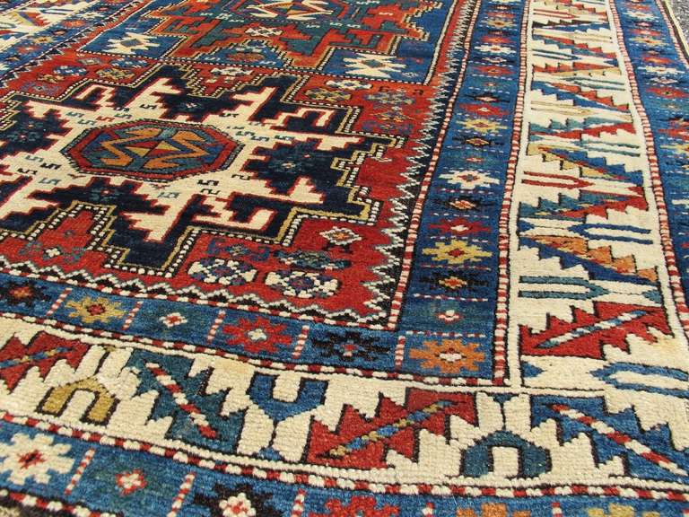 Late 19th Century Varied Red and Blue Lesghi Star Kuba Rug In Excellent Condition For Sale In San Francisco, CA