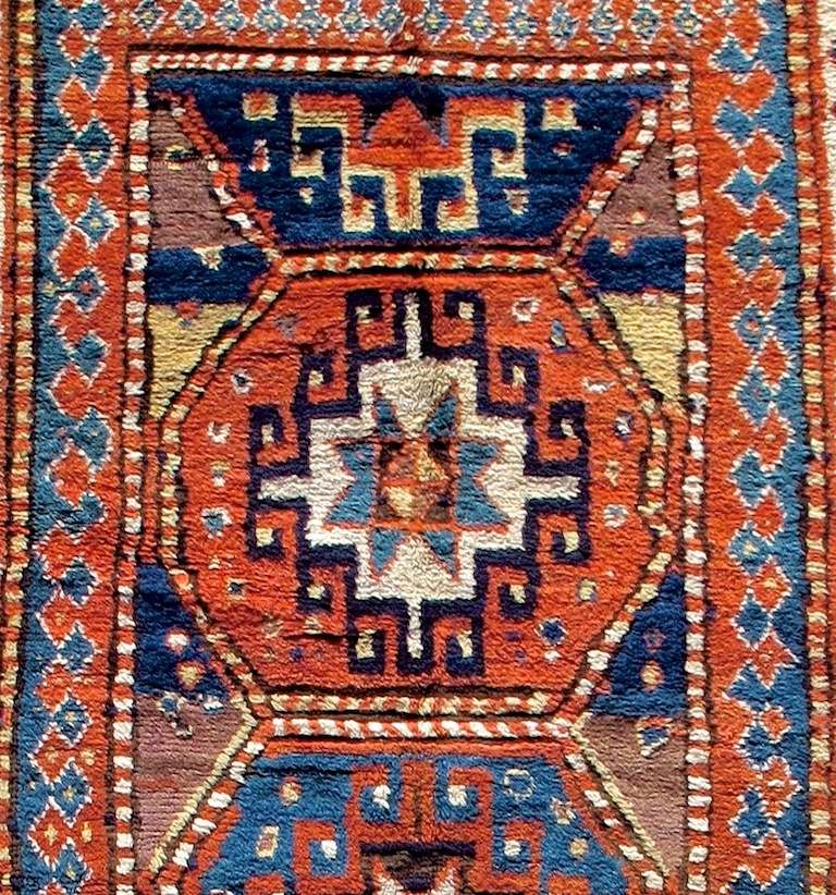 Late 19th Century Geometric Red Caucasian Kazak Rug with Three Medallions In Excellent Condition For Sale In San Francisco, CA
