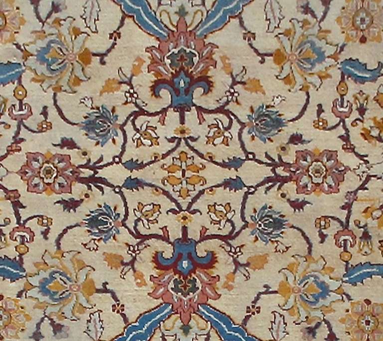 This highly refined Amritsar carpet combines Classic persianate drawing with a local Indian color sensibility that harkens back to Mughal predecessors from the seventeenth century. Large scale highly detailed palmettes are drawn within a mirrored