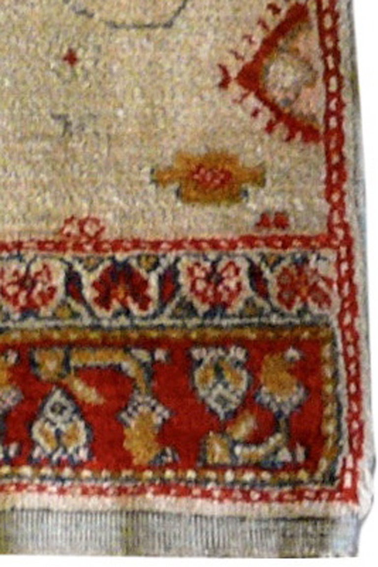 It is rare to find small Agra rugs of this vintage. Having an ivory background and an unusual design makes this rug particularly desirable. It is one of a matching pair but they are being offered separately.