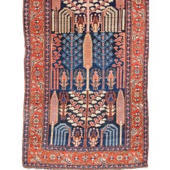 Late 19th Century Red and Indigo Northwest Persian Long Rug with Floral Elements