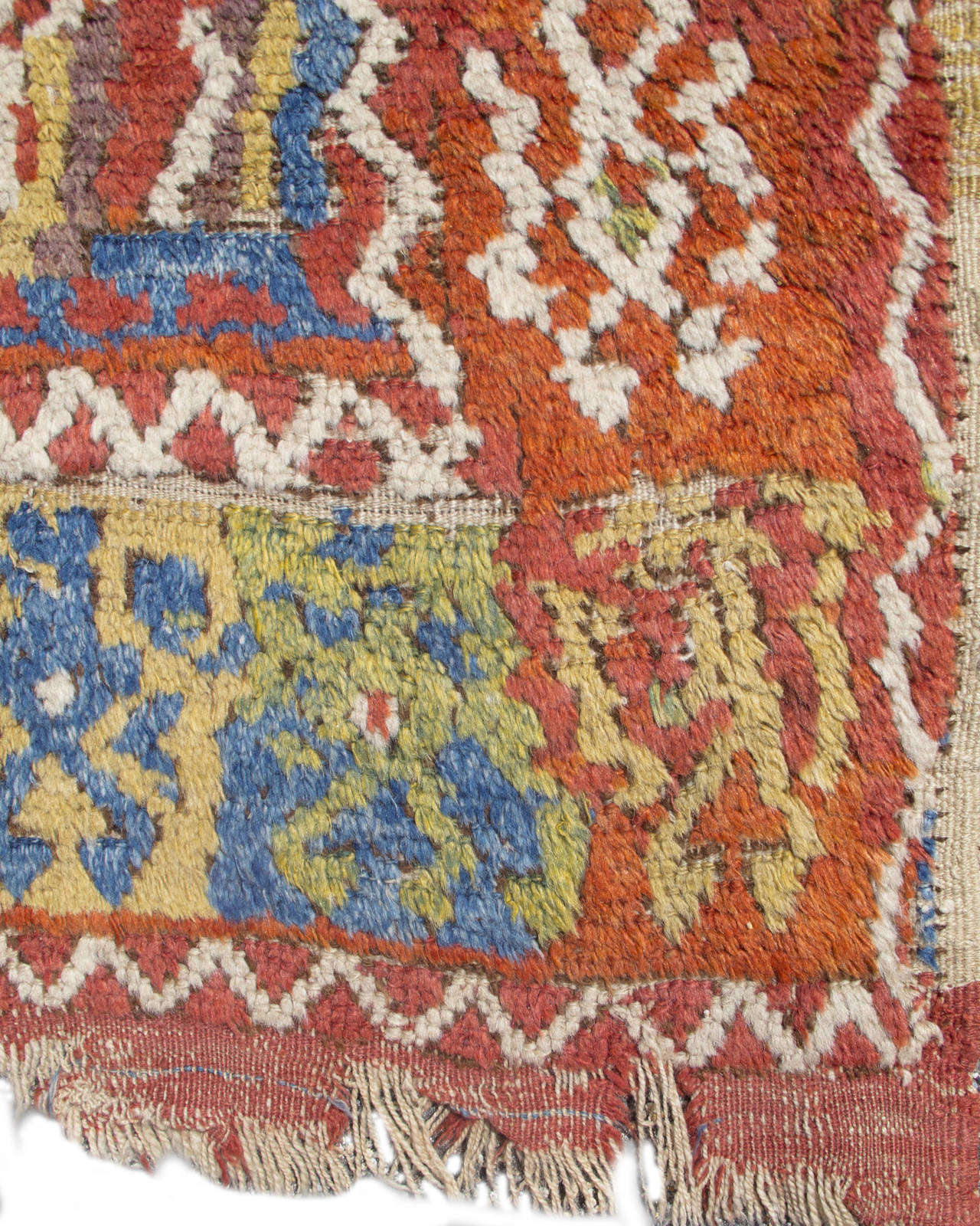 This Konya area, village ‘yatak’, or sleeping rug, is a vibrant example of the dynamic village weaving of the 18th and early 19th centuries. Two beautifully colored stepped medallions center the field--each circumscribed by bright ivory latch-hooks.