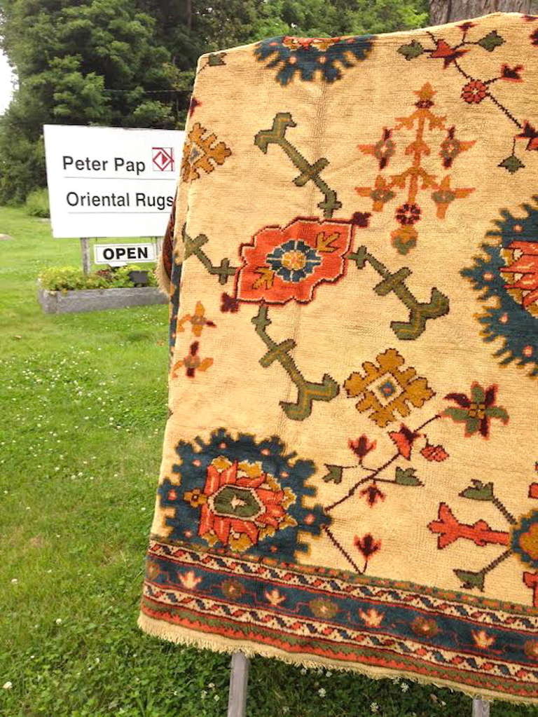 This square-shaped western Anatolian carpet has a great Arts and Crafts look with large-scale drawing of ornament derived from 18th-century Persian precursors. The effect is simple and refined.