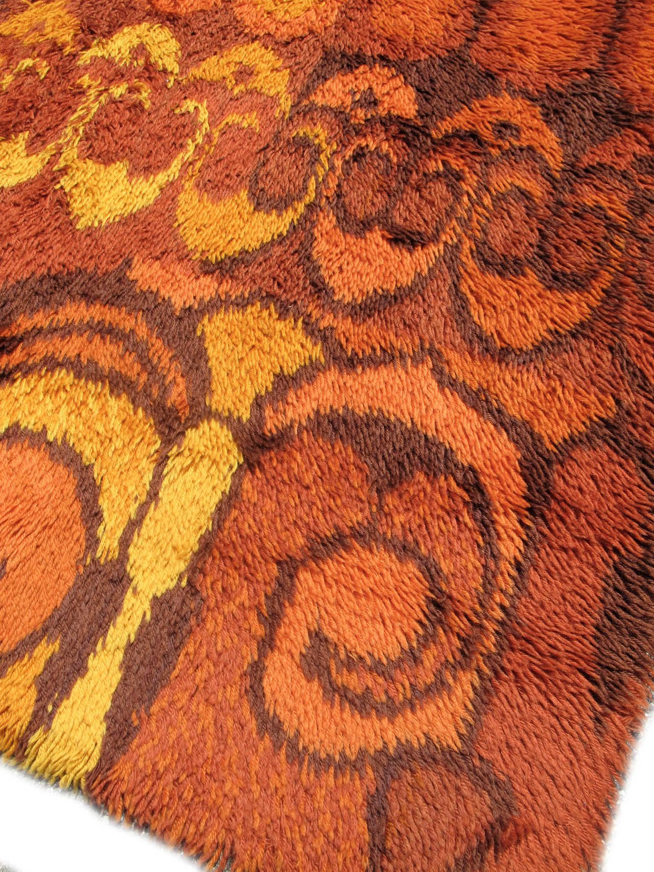 This fantastically chic Scandinavian piece reflects the modernist aesthetics of the late 1960s and early 1970s. Woven with autumnal colors of golds and rusts, repeat forms derived from earlier Art Nouveau vegetal design are repeated to form an