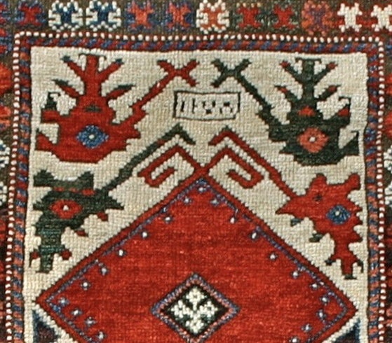 Dated 1278 AH (1861-2), this Turkish prayer rug from the Balikesir region, slightly inland from the Marmara coast in northwestern Anatolia, blends features of design from the Aegean coastal regions further southwest with a distinct local