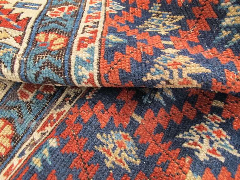 19th Century Blue, Red, and Ivory Caucasian Kuba Rug In Good Condition For Sale In San Francisco, CA