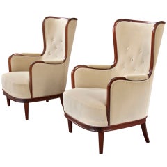 A Large Pair of Mahogany Wingback Chairs by Carl Malmsten