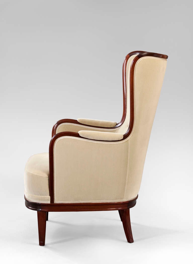 Modern A Large Pair of Mahogany Wingback Chairs by Carl Malmsten