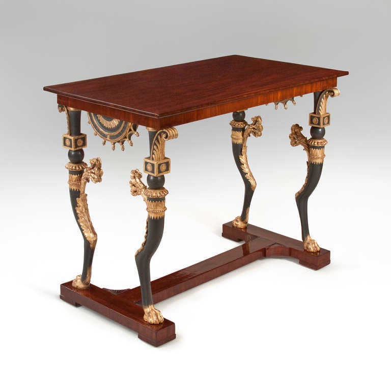 The rectangular top, above a conforming apron, supported by four richly adorned monopodia, on an H-shaped base, terminating in four block feet. 

More tables also available at: www.hmluther.com

This piece @ H.M. Luther 
The Carlyle
35 East