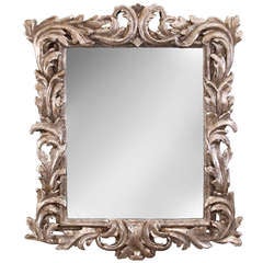 An Italian Baroque Foliate Carved Silvered Wood Mirror