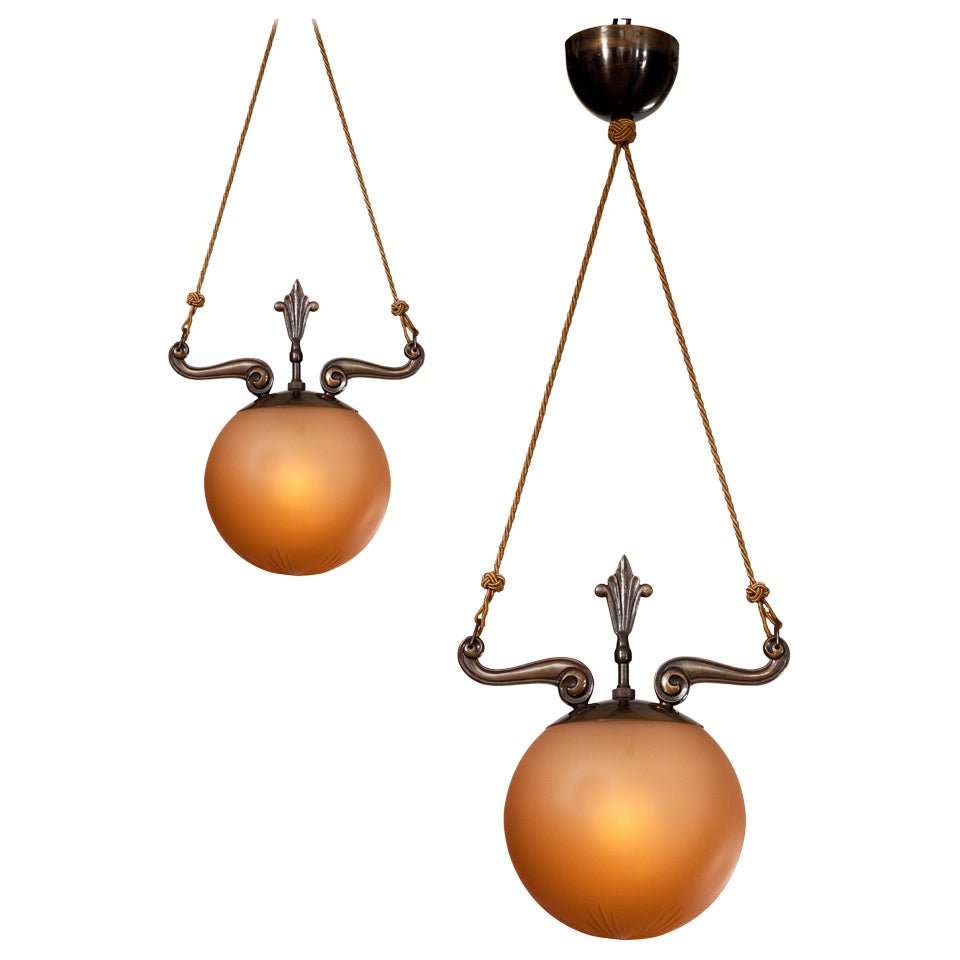 A Pair of Bronze and Glass Chandeliers Attributed to Knut Hallgren