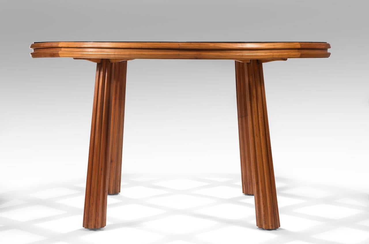 Italian Osvaldo Borsani, A Circular Cherry Wood and Silvered Glass Table