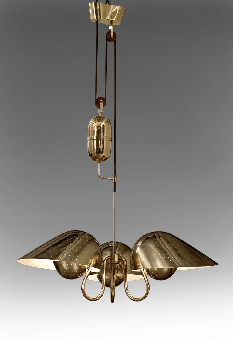 Mid-Century Modern An Adjustable Brass, Bakelite and Wood Chandelier by Bertil Brisborg