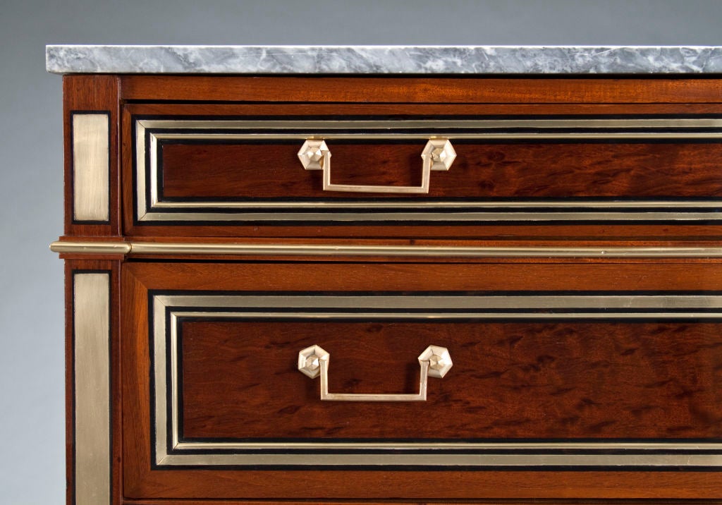 A Louis XVI Brass, Mahogany, and Bleu Turquin Top Commode