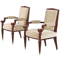 A Pair of Brass Mounted Carved Mahogany Armchairs by Pierre Cruège
